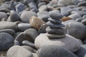 folded chubby pebbles on the beach