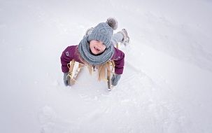 child is sledding