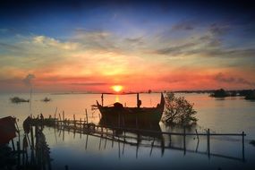 landscape of boat on marina at dawn