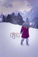 Child on the beautiful snowy mountain