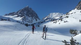 skiers in lech valley on a sunny day