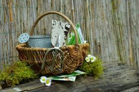 wicket basket with garden tools