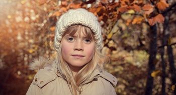 girl in the autumn landscape close-up