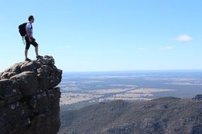 tourist on a cliff on a sunny day