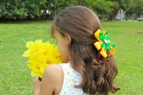 Girl with yellow flowers