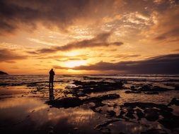 fisherman at sunrise on the ocean