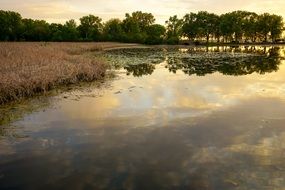 beautiful sunset landscape over a rural lake