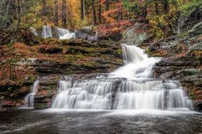 factory falls, cascading waterfall among the autumn forest, usa, pennsylvania