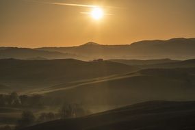 sunset over the mountains in Tuscany