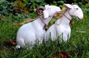 Figures of white sheeps