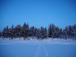 road through a snowy lake