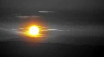 hot Sun above at grey Landscape