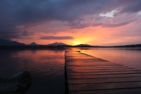 romantic sunset over the wooden pier