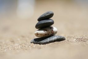 stone tower on a sandy beach