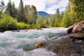 foamy stream among stone cascades