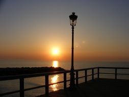 landscape of sunset over the coast and lantern