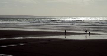 People on the beach in autumn