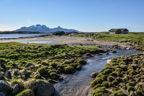 creek, meadow and mountains on a sunny day