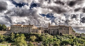 medieval castle under the clouds in italy