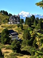 photo of luxury mansions in the mountains in Switzerland