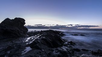 quiet rocky coast of Spain at dusk