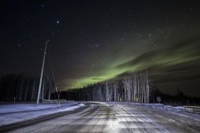 Northern Lights over the winter road