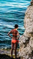 Picture of Girl is on a rocky beach