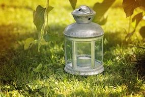 Silver lantern on a grass