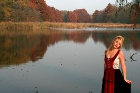 pretty blonde Girl Lake Autumn Tree