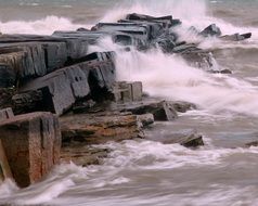 panoramic view of stone breakwater on cleveland coast