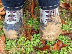 boots in the mud on autumn foliage