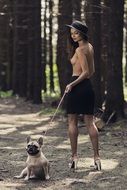 nude girl with french bulldog in the park