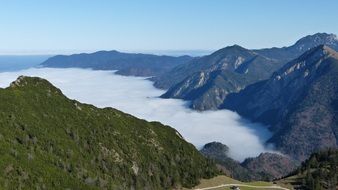 amazing Alpine Mountains over Blue Fog, germany