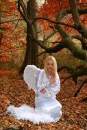 Girl in white Angel dress Autumn Wings Leaves