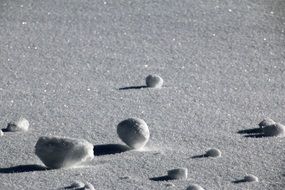 Beautiful snow balls on the beautiful shiny snow in winter