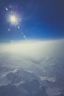bright sun over the glacier in the alps
