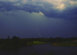 lightning in the stormy sky over the coast