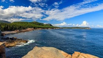 Beautiful, romantic seaside with rocks and green trees