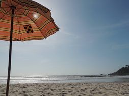 sun umbrella on a sandy beach in brazil