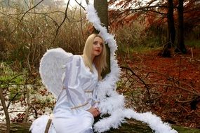 Blonde beautiful Woman in white dress autumn Forest