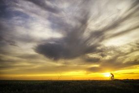 cyclist on the Sun Cloud sunset
