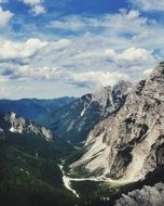 panorama of a green valley on a background of mountains