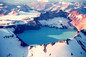 Crater of Dormant Volcano in snowy mountain Landscape, usa, alaska