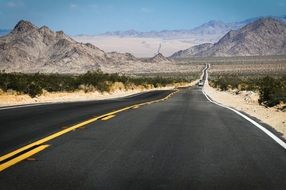 panoramic view of a highway amidst scenic landscapes in arizona