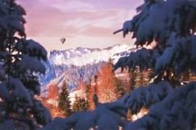 hot air balloon over mountain landscape in winter