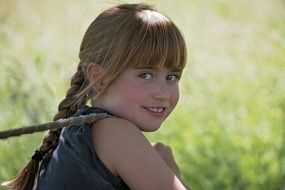 blond girl with rope outside
