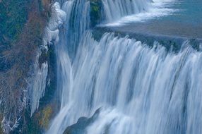 cascading waterfall in winter