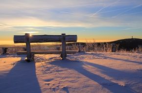 Beautiful snowy landscape of Ore Mountains in colorful sunrise in Fichtelberg, Germany