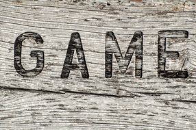 inscription game on wooden board