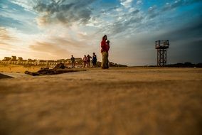 people at the evening beach